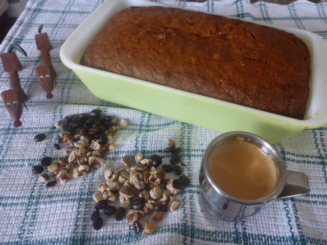 Delicious fresh baked Banana Bread in a light green loaf pan.