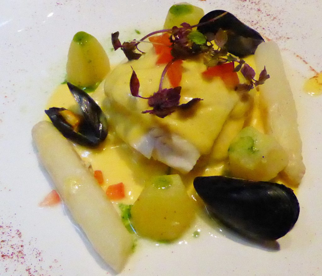 A dish of white asparagus and fish at Breydel De Conic restaurant.