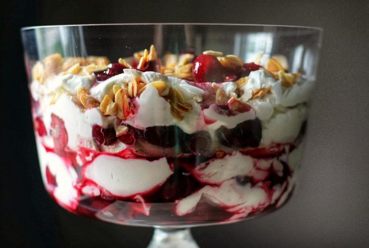 This Cherry Mess is a no fuss dessert featuring red wine soaked cherries mixed with amaretto laced whipping cream. Add crispy meringues, and crunchy sweet almonds for great textural effect. #etonmess #trifle #dessert