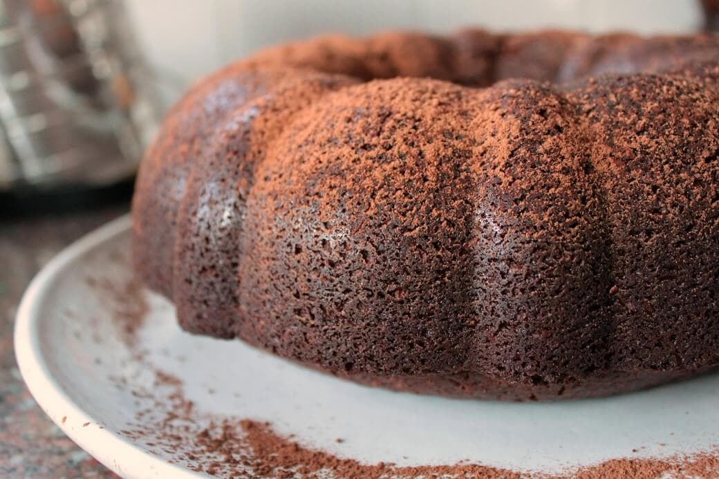 This Chocolate Porter Coconut Cake is a rich, dense cake with a bit of sweetness from coconut and a whole lot of flavour from Longboat Chocolate Porter. #chocolatecake #chocolateporter #stoutcake #davidlebovitz #bundtcake