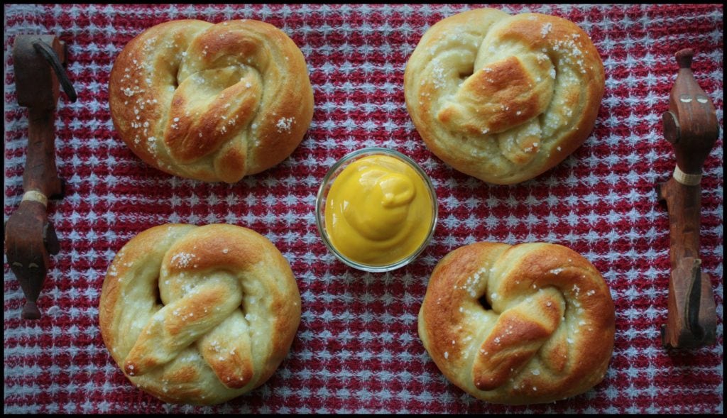Golden baked soft pretzels with mustard dip.