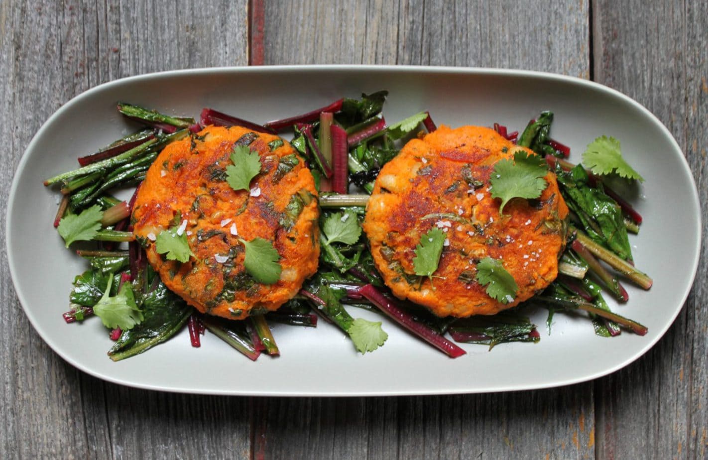 Foodies rejoice, you can have your lawn and eat it too! Celebrate the first signs of Spring with these Sweet Potato Patties on Sautéed Dandelion Greens. The sweet nature of the Sweet Potato Patties are a perfect companion to the bitter dandelion greens. Season with coarse flaky salt and enjoy! #vegan #sweetpotatoes #dandelion #foraged