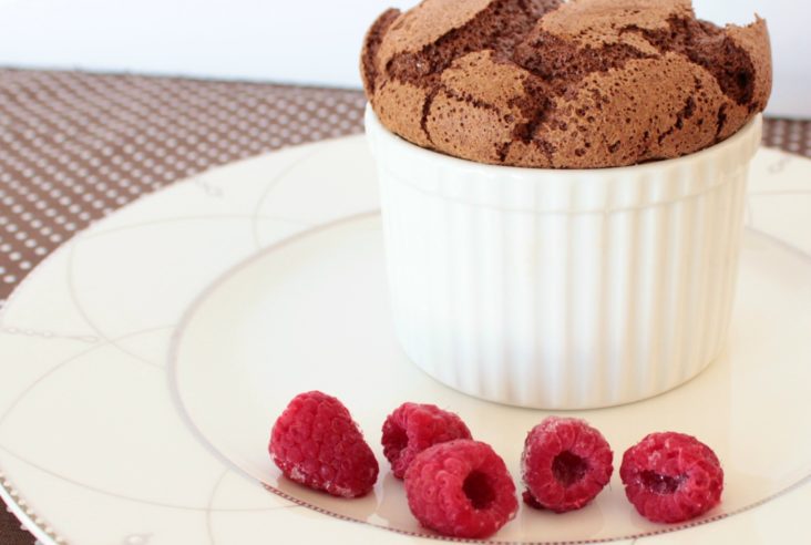 A light airy chocolate souffle served with raspberries.