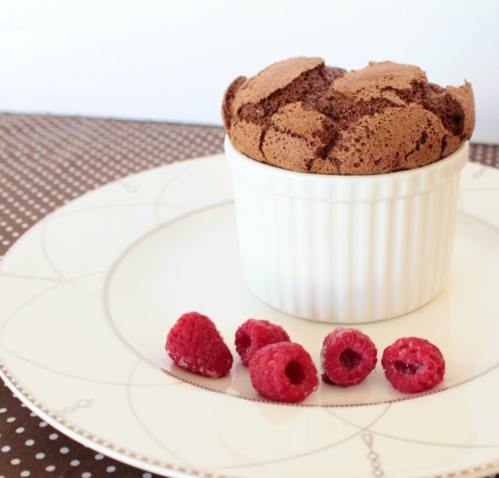 A light airy chocolate souffle served with raspberries.
