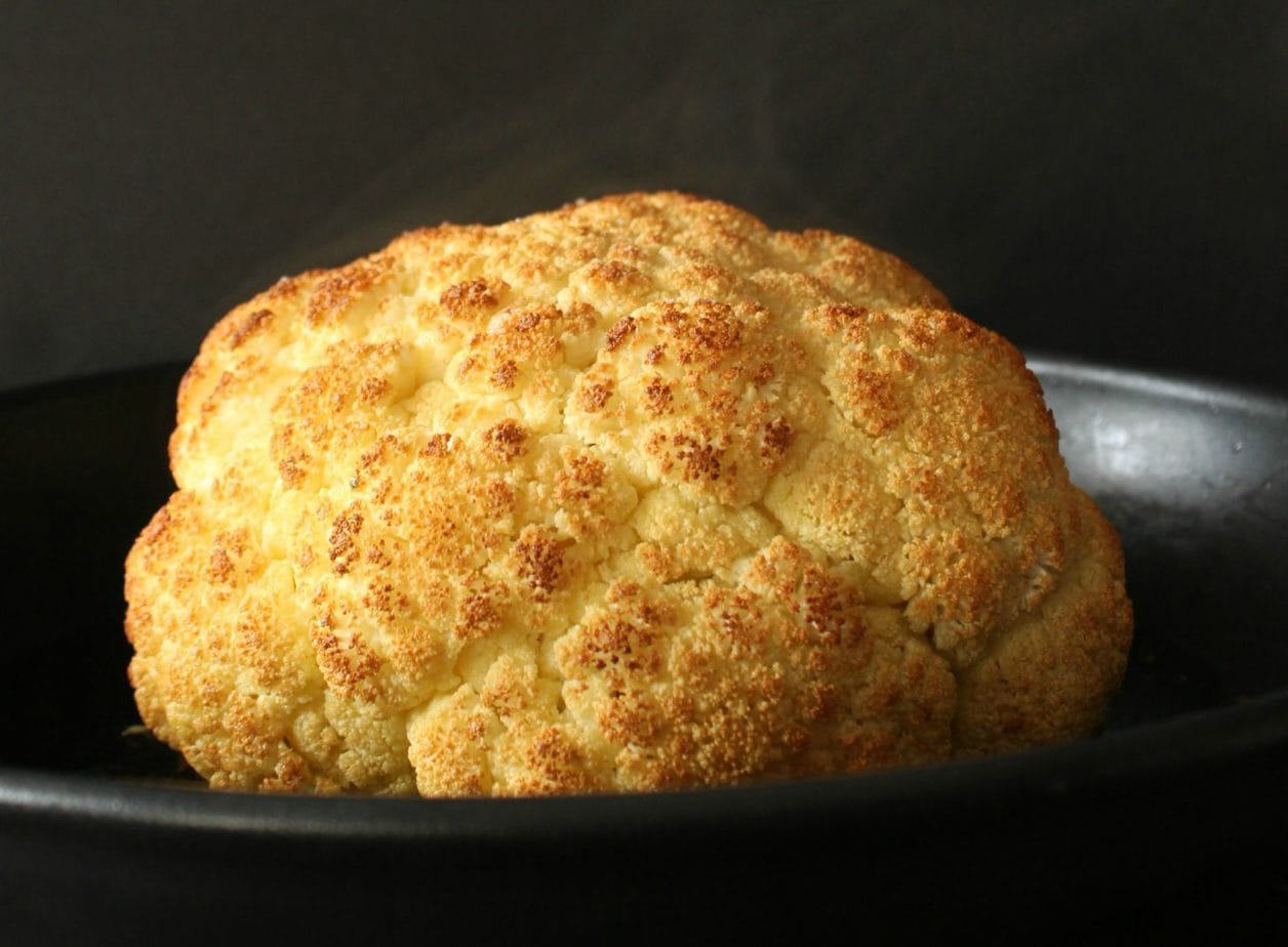 A Perfectly Whole Roasted golden Cauliflower