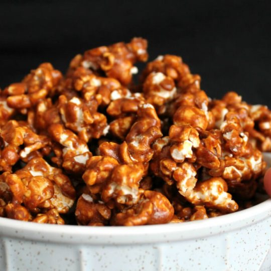 A bowl filled with Gingerbread Caramel Popcorn