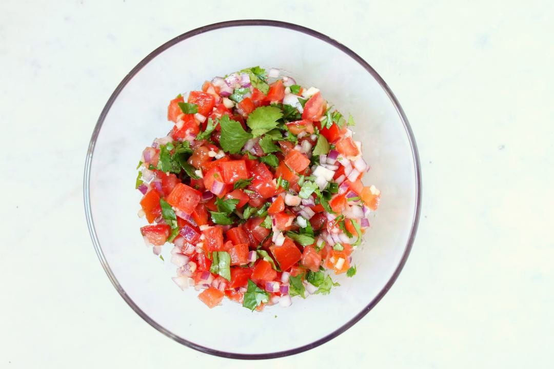 This Fresh and Zesty Pico de Gallo is a great way to add freshness and flavour to any dish. Use it on top of a casserole, chicken, fish, or just scoop it up with tortilla chips. #picodegallo #salsa #dips #snacks
