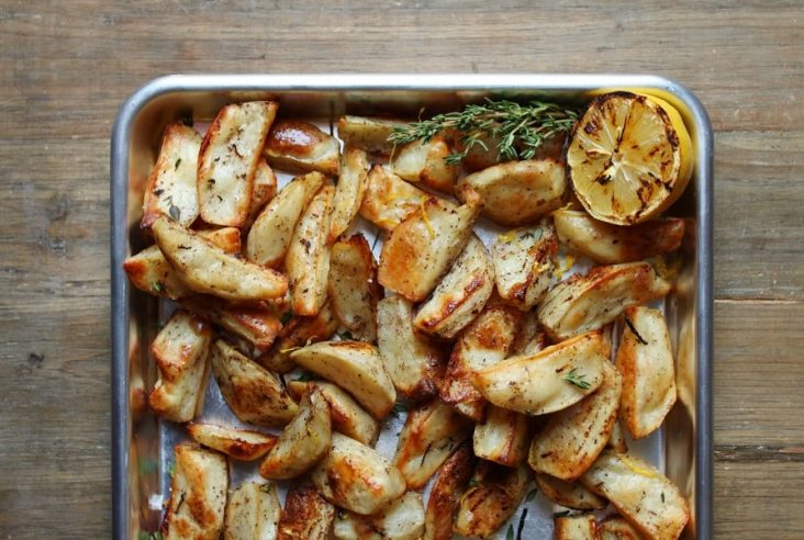 These perfectly roasted potatoes are so easy to make. Add lemon juice and zest for brightness and lemon pepper for a bit of a peppery kick. #lemonpotatoes #roastedpotatoes #sides