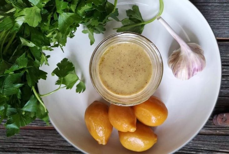 A bright and zesty tahini salad dressing featuring preserved lemons. #preservedlemons #saladdressing #dressing #salad #tahini #tahinidressing
