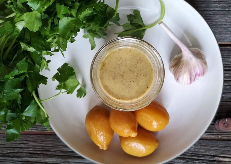 A bright and zesty tahini salad dressing featuring preserved lemons. #preservedlemons #saladdressing #dressing #salad #tahini #tahinidressing