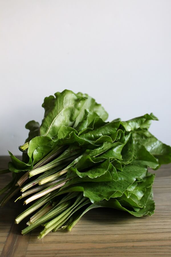 A stack of fresh beet leaves