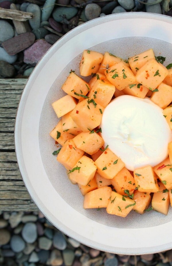 Cantaloupe Salad with white burrata, mint, and chilies.