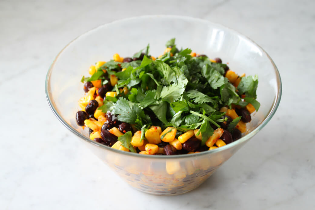 a bowl of corn and bean cilantro salad.