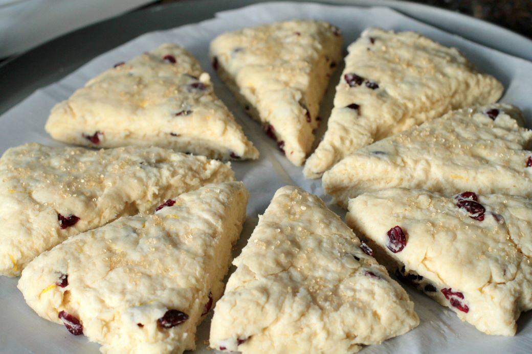 Cranberry Lemon Scones - Unbaked scones cut into triangles and ready to bake. 