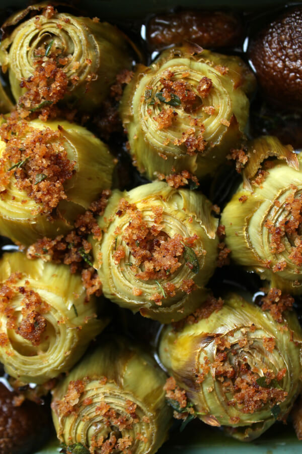 Close up of Roasted Baby Artichokes topped with bread crumbs.