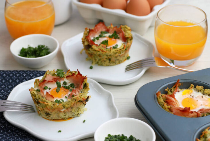 White table scene breakfast setting with Baked Ham and Egg Hash Brown Cups.