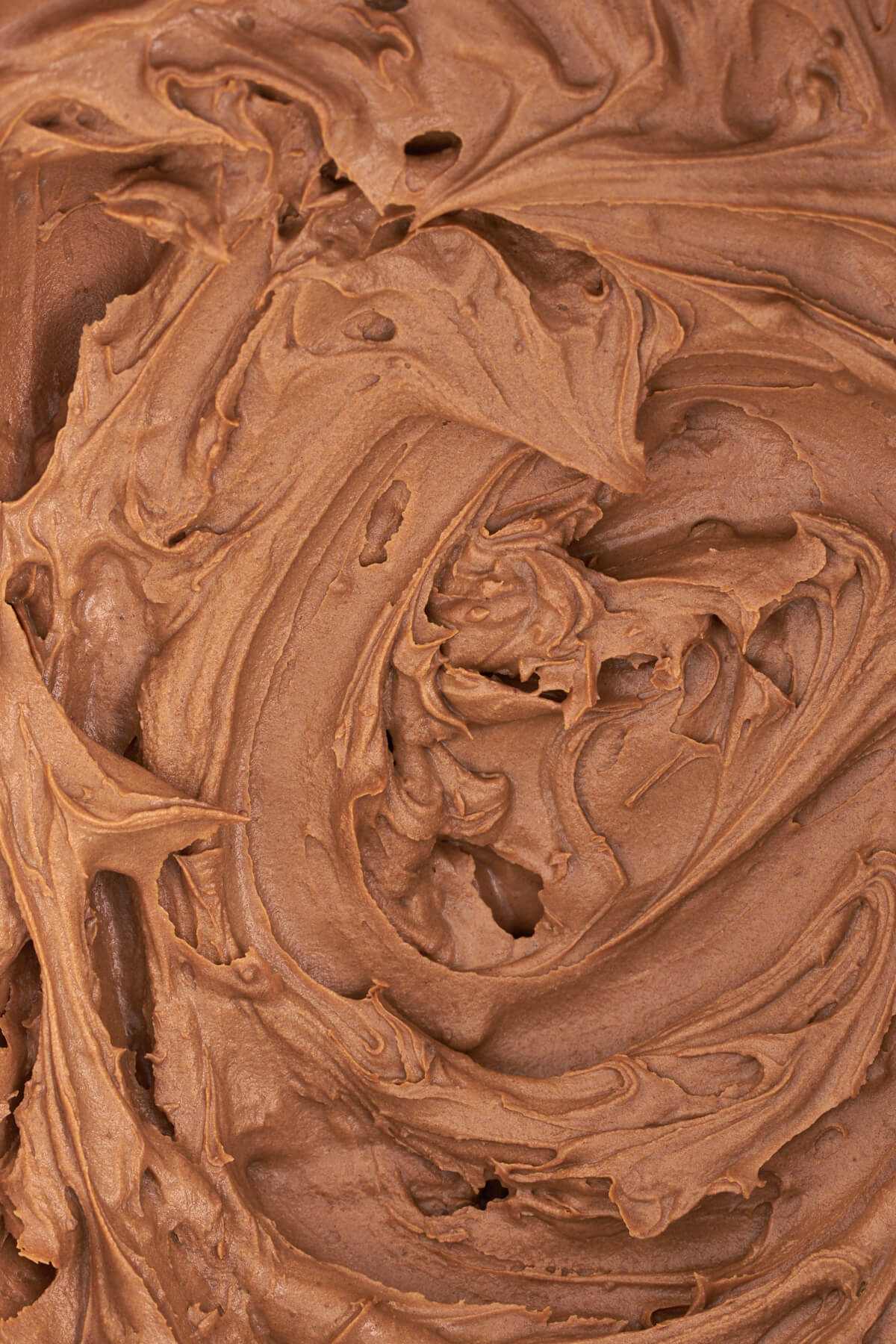 Close up of brown nutella frosting.