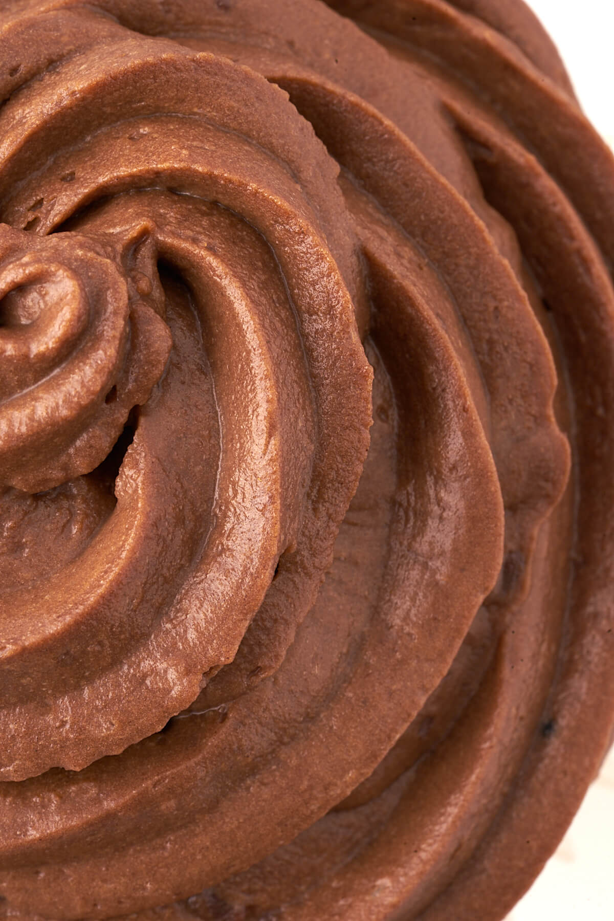 Close up swirls of chocolate Nutella frosting.