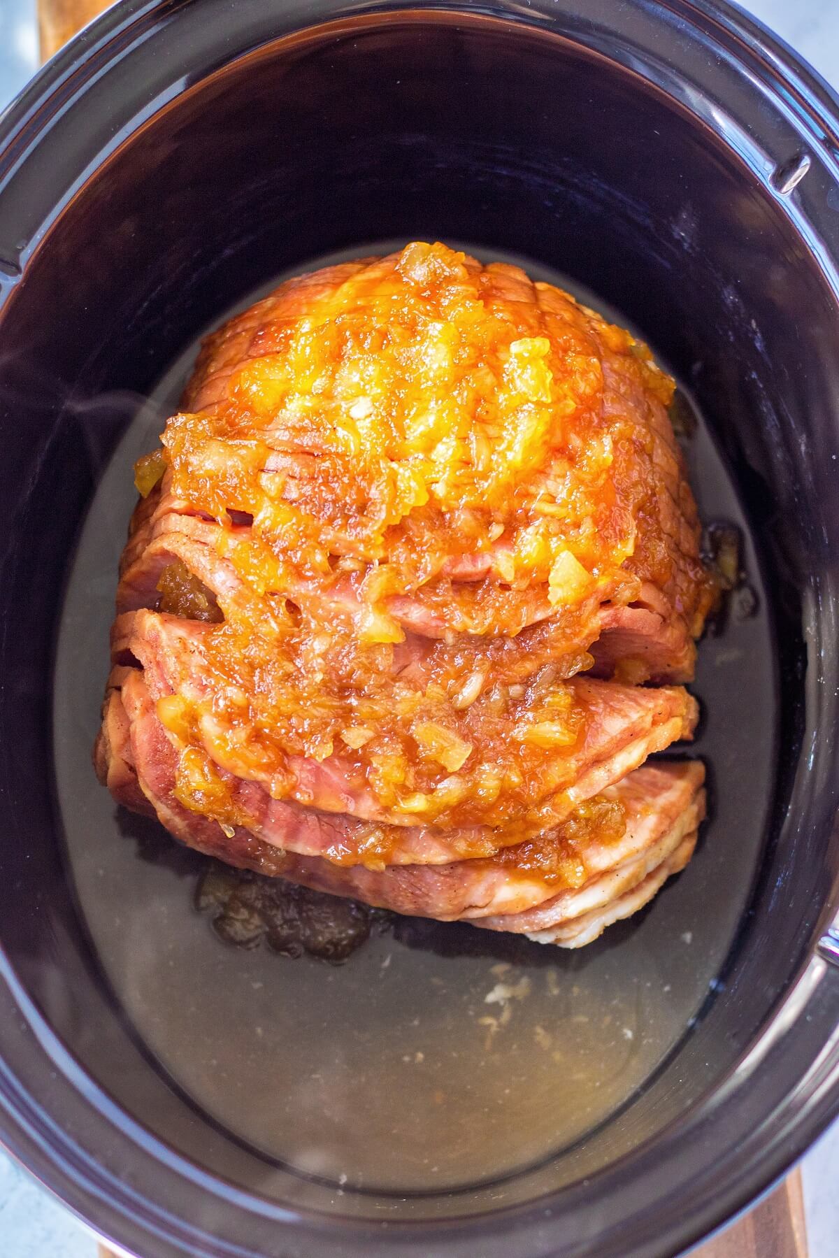 Spiral Sliced Ham glazed with Pineapple and Cola in a Slow Cooker.