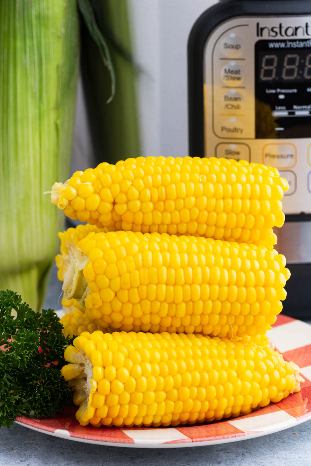 A golden yellow stack of cooked Instant Pot Corn on the Cob.
