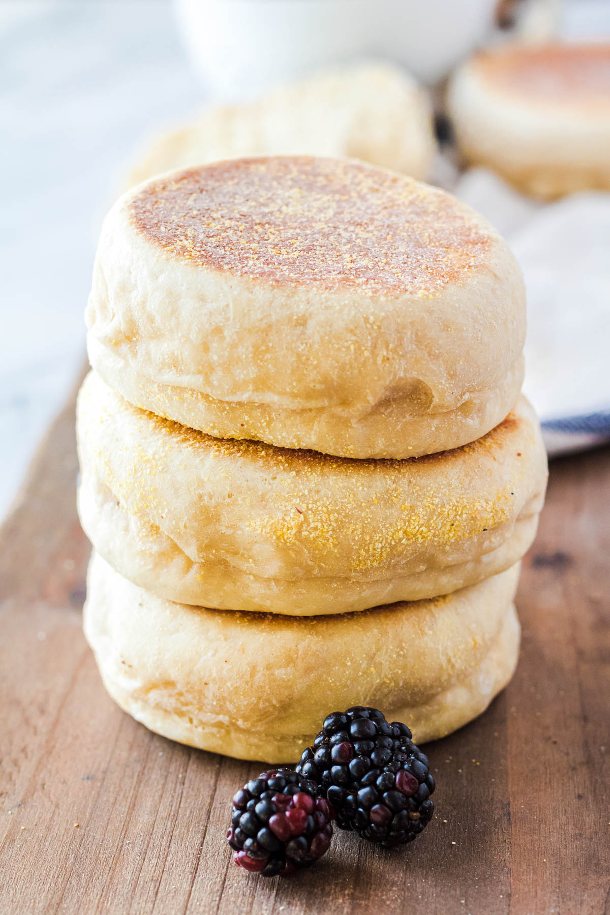 A stack of golden English Muffins.
