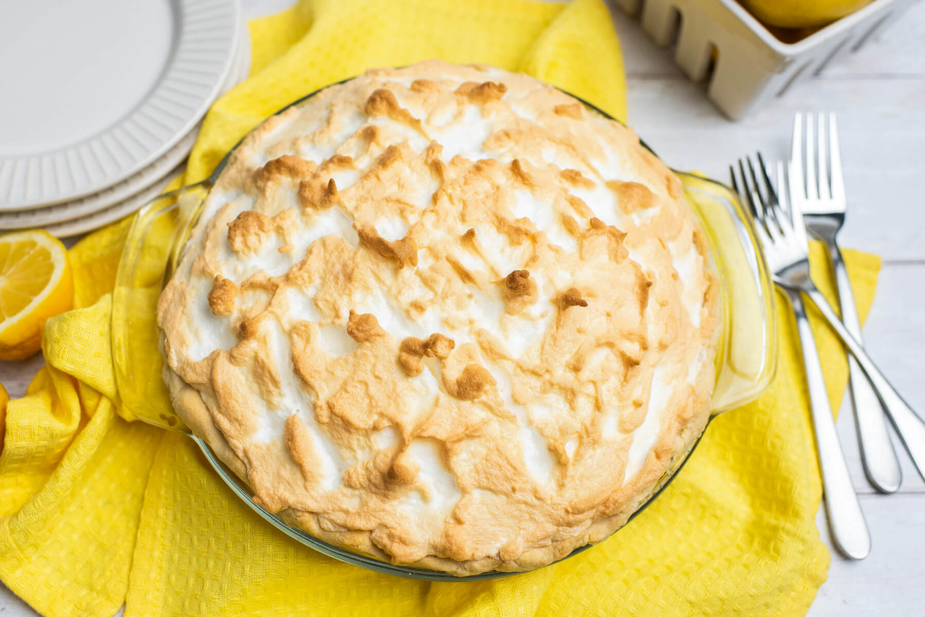 A fully baked lemon meringue pie ready to serve.