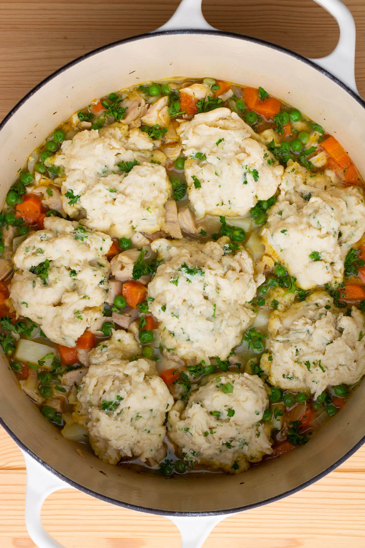 A Dutch oven full of Chicken and Dumplings.