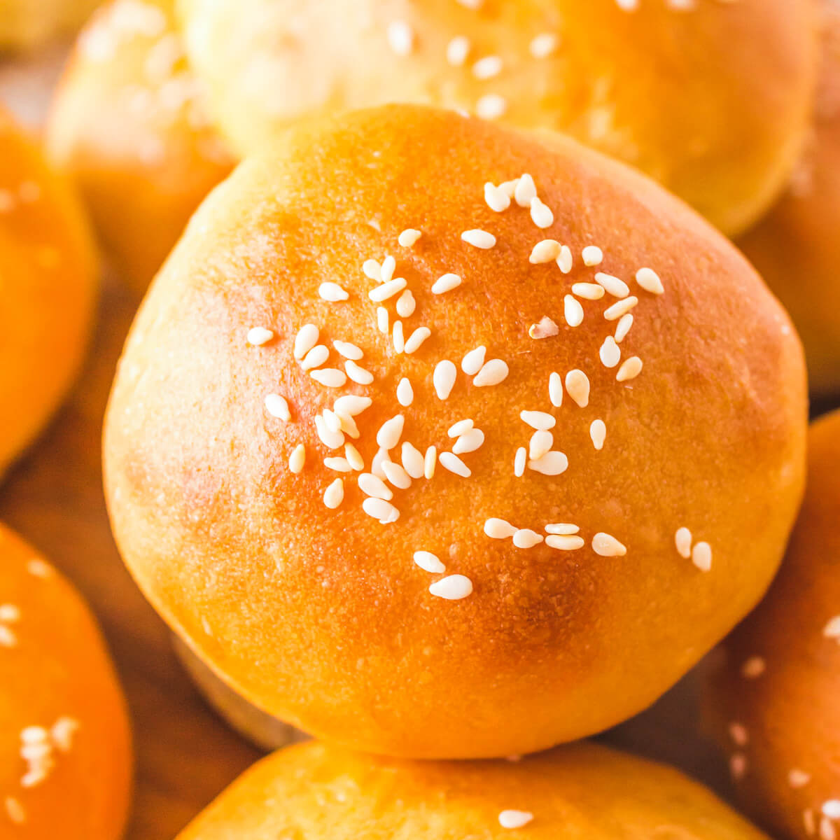 A baked easy dinner roll topped with sesame seeds.