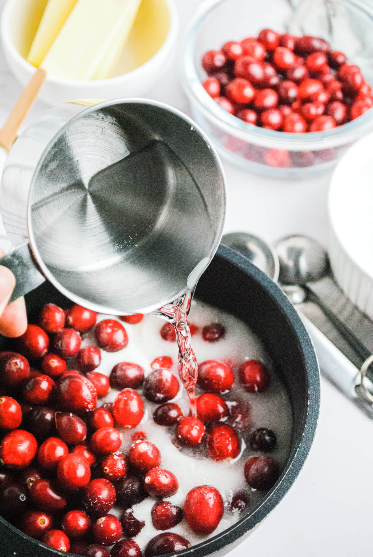 Fresh cranberries in a saucepan about to be cooked into cranberry sauce.