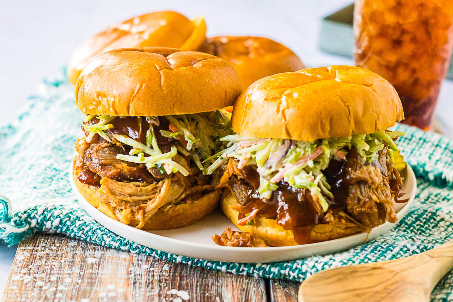 Soft white buns filled with Root Beer Pulled Pork and coleslaw.
