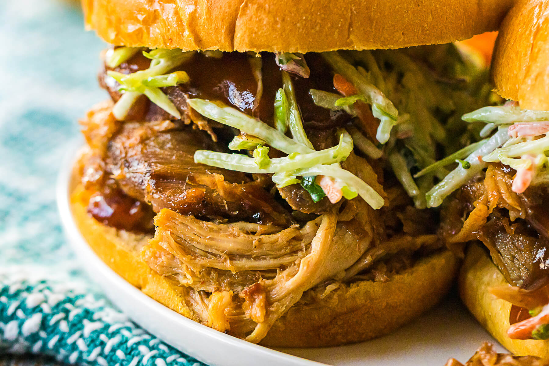 A soft white bun filled with Root Beer Pulled Pork and coleslaw.