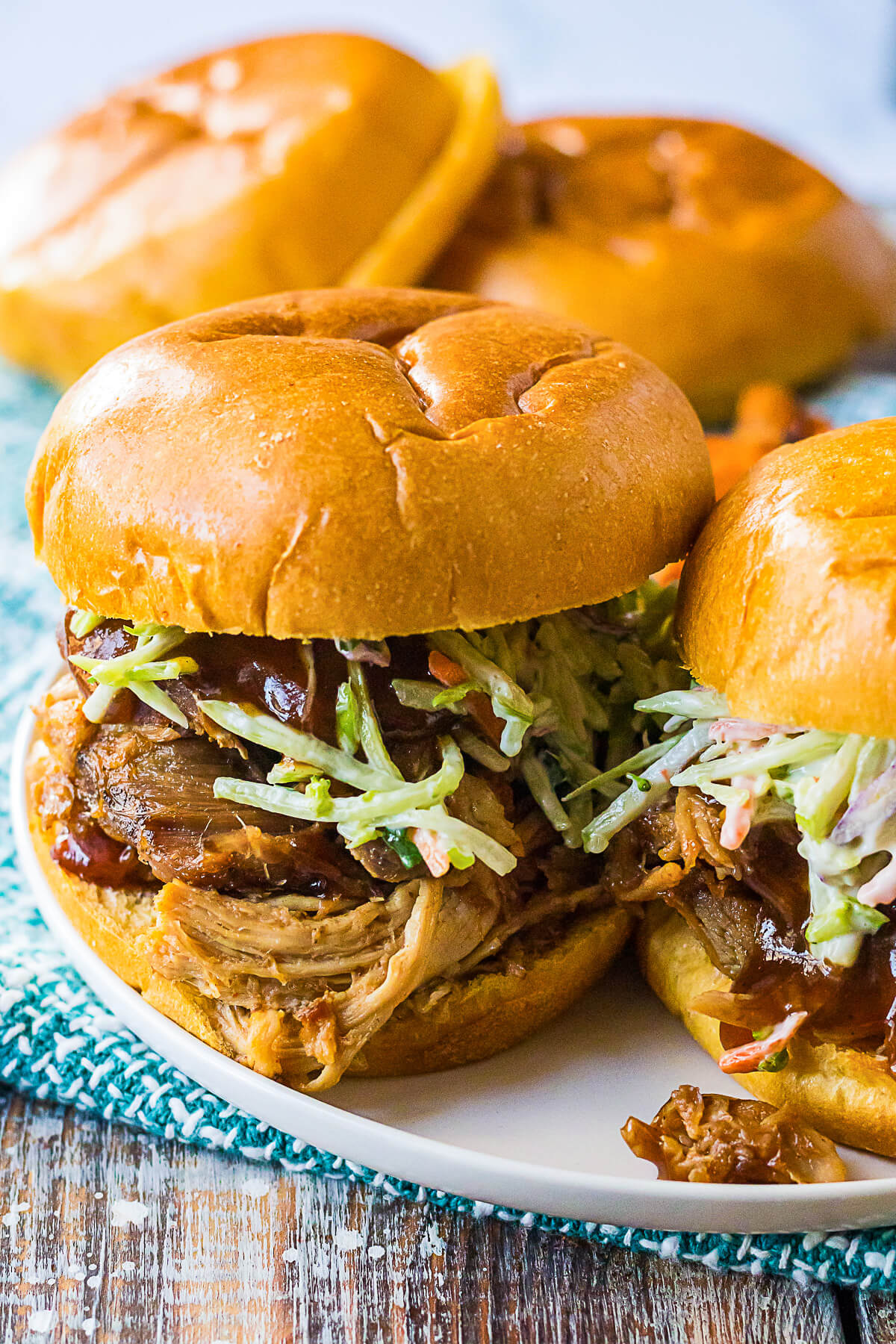 Soft white buns filled with Root Beer Pulled Pork and coleslaw.