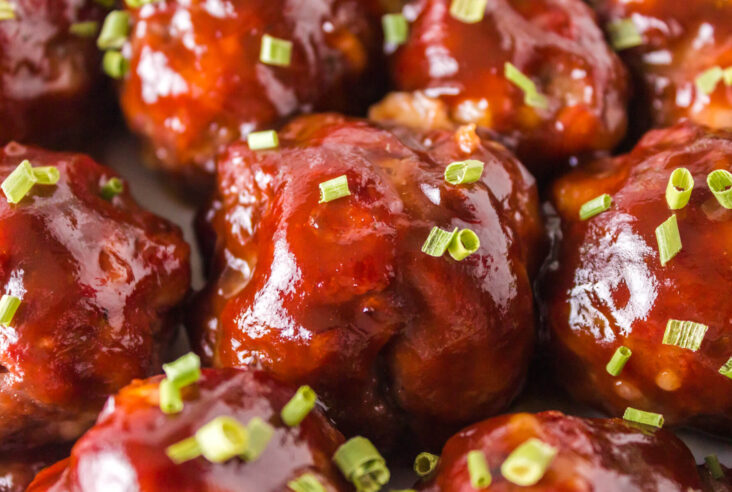 A bowl of Smoked Meatballs glazed in BBQ Sauce.