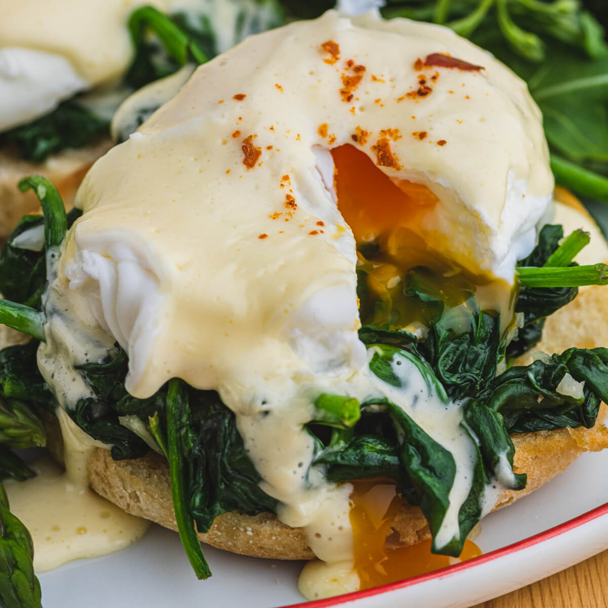 An Eggs Benedict Florentine with runny yolk.