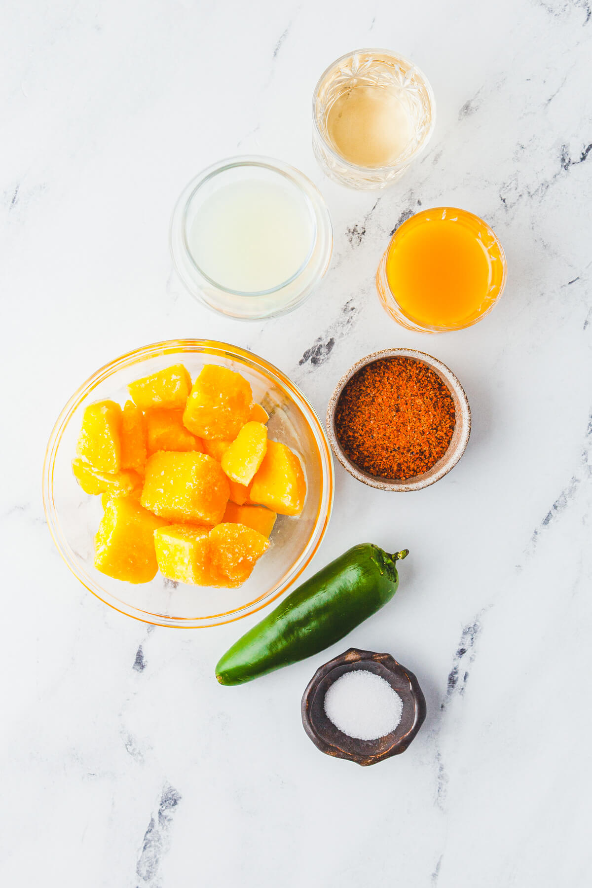 Ingredients required to make Spicy Mango Margaritas.