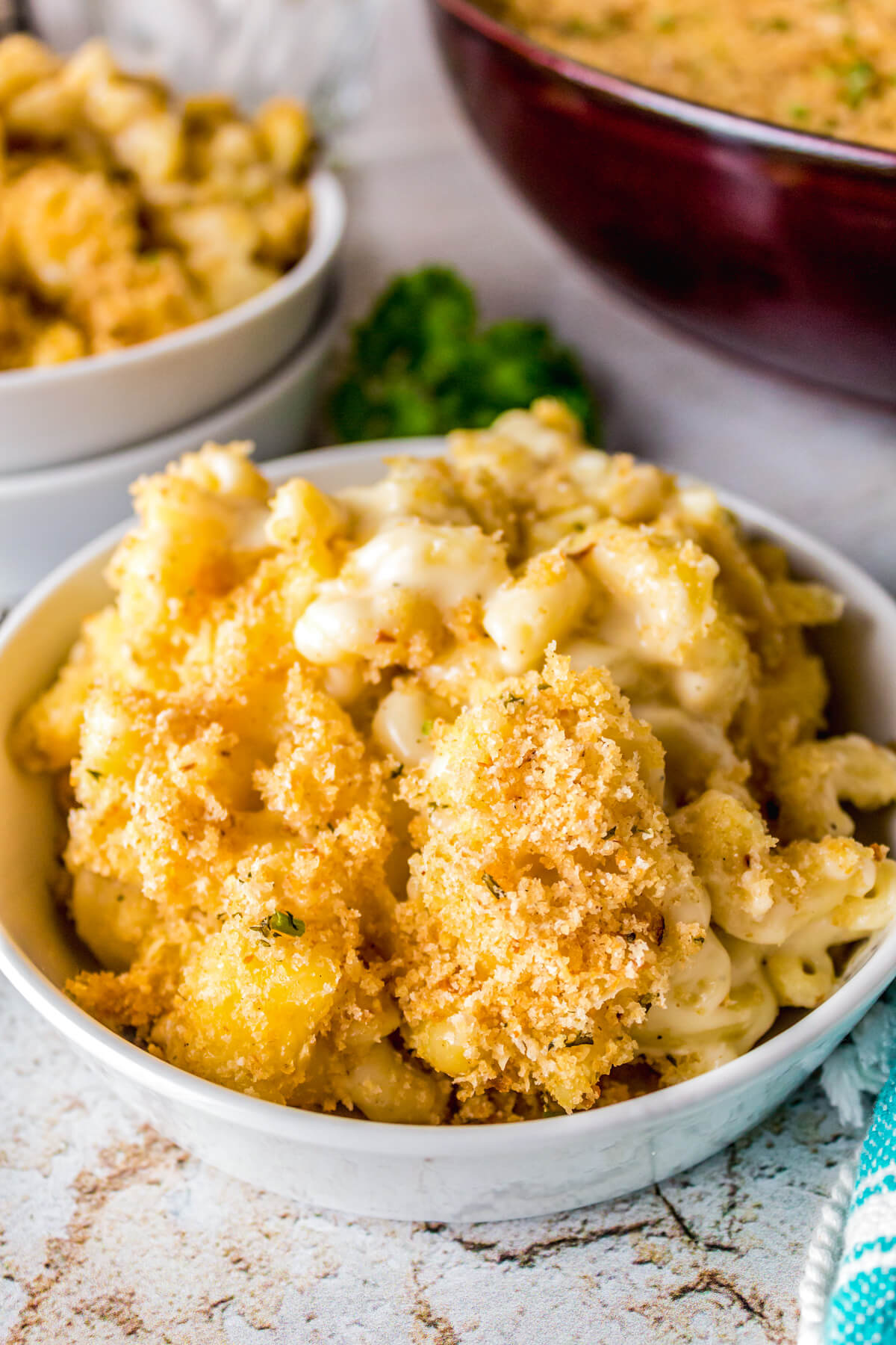 A bowl of creamy Smoked Mac and Cheese topped with toasted golden bread crumbs.