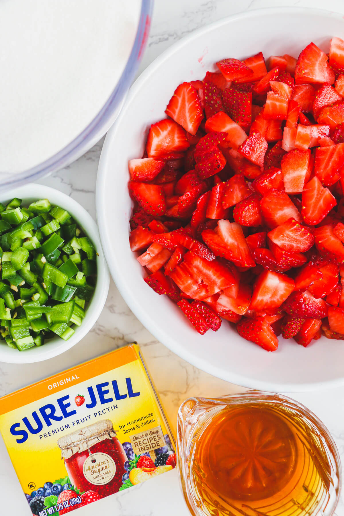 Ingredients required to make Strawberry Jalapeño jam.