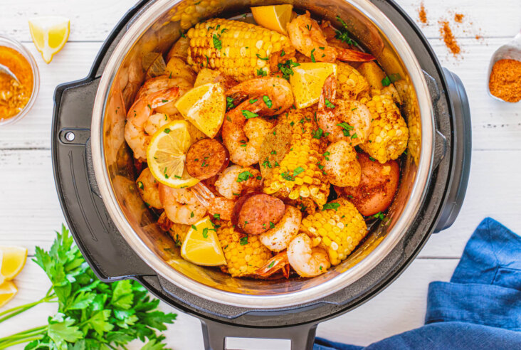 Cooked shrimp boil - Spice coated shrimp, potatoes, and corn in an Instant Pot.
