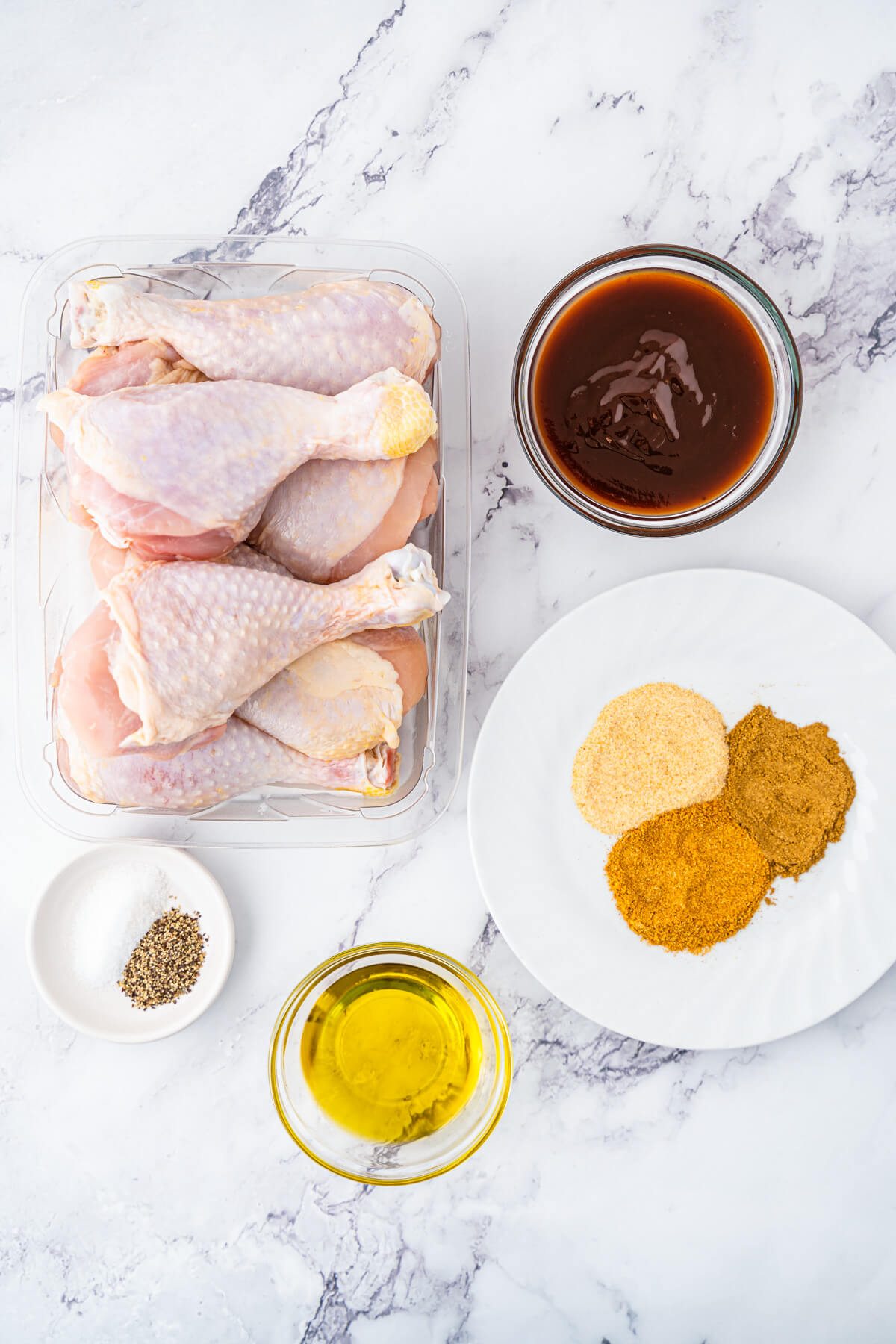 Ingredients required to make air fryer chicken drumsticks with barbecue sauce.