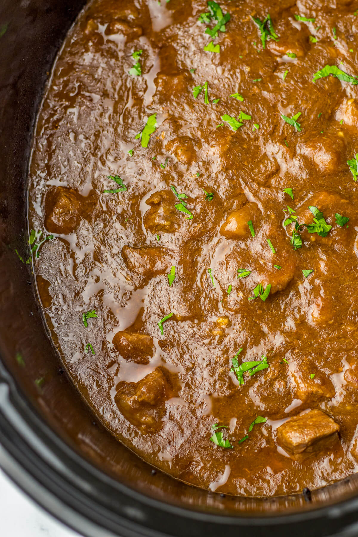 Tender slow cooked beef tips in a rich and flavourful gravy in a slow cooker.