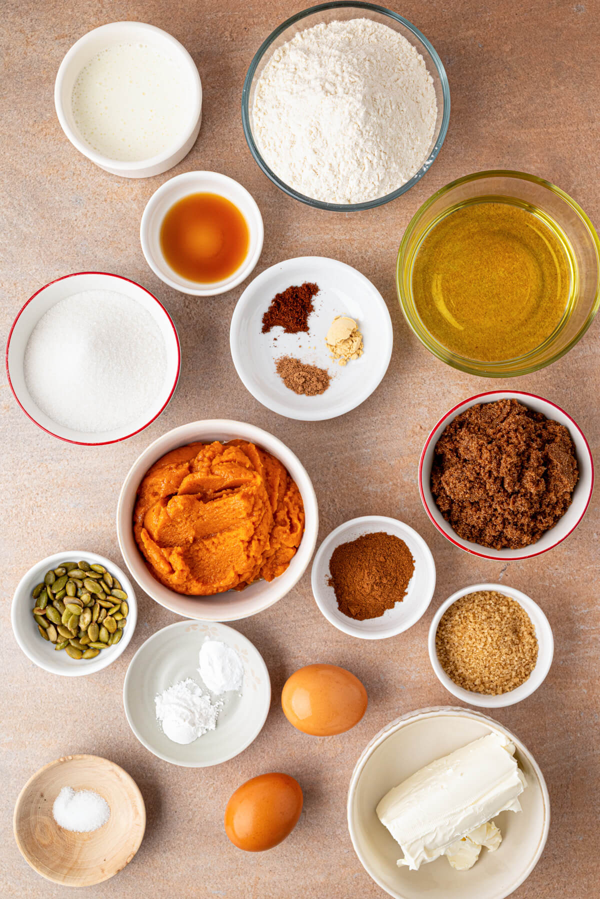 Ingredients required to make Pumpkin Cream Cheese Muffins.