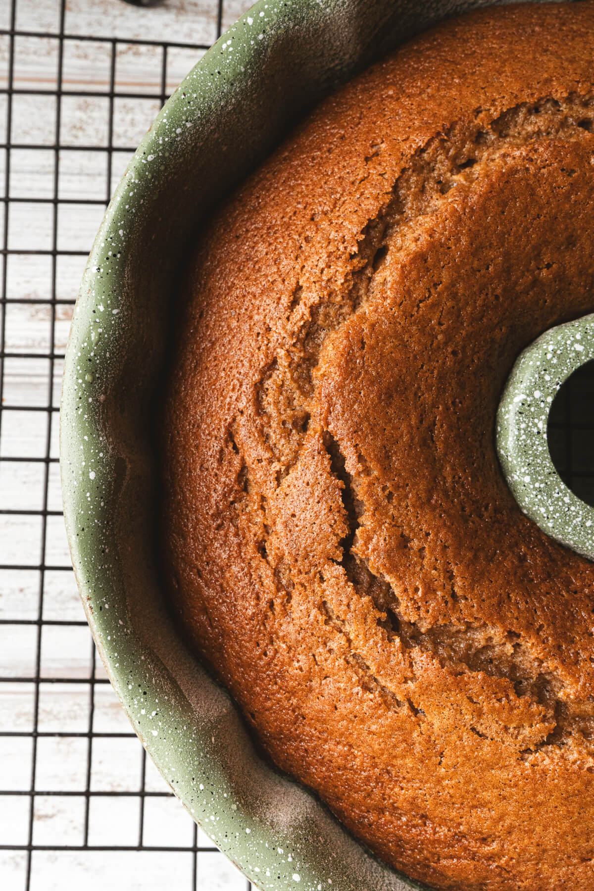 A perfectly baked apple cider donut cake in a bundt cake pan.