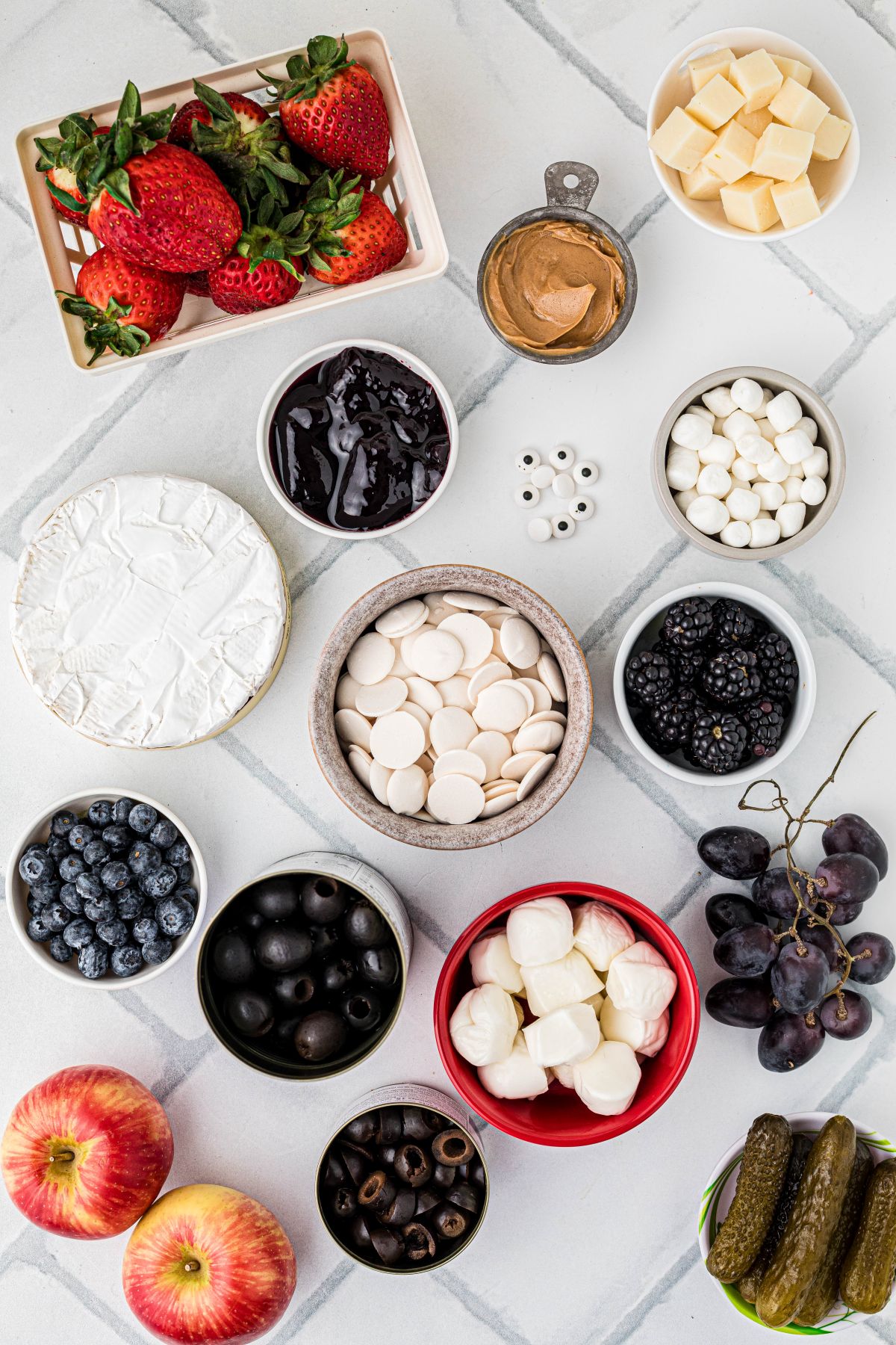 Suggested ingredients to make a fun and frightful Halloween Charcuterie Board.
