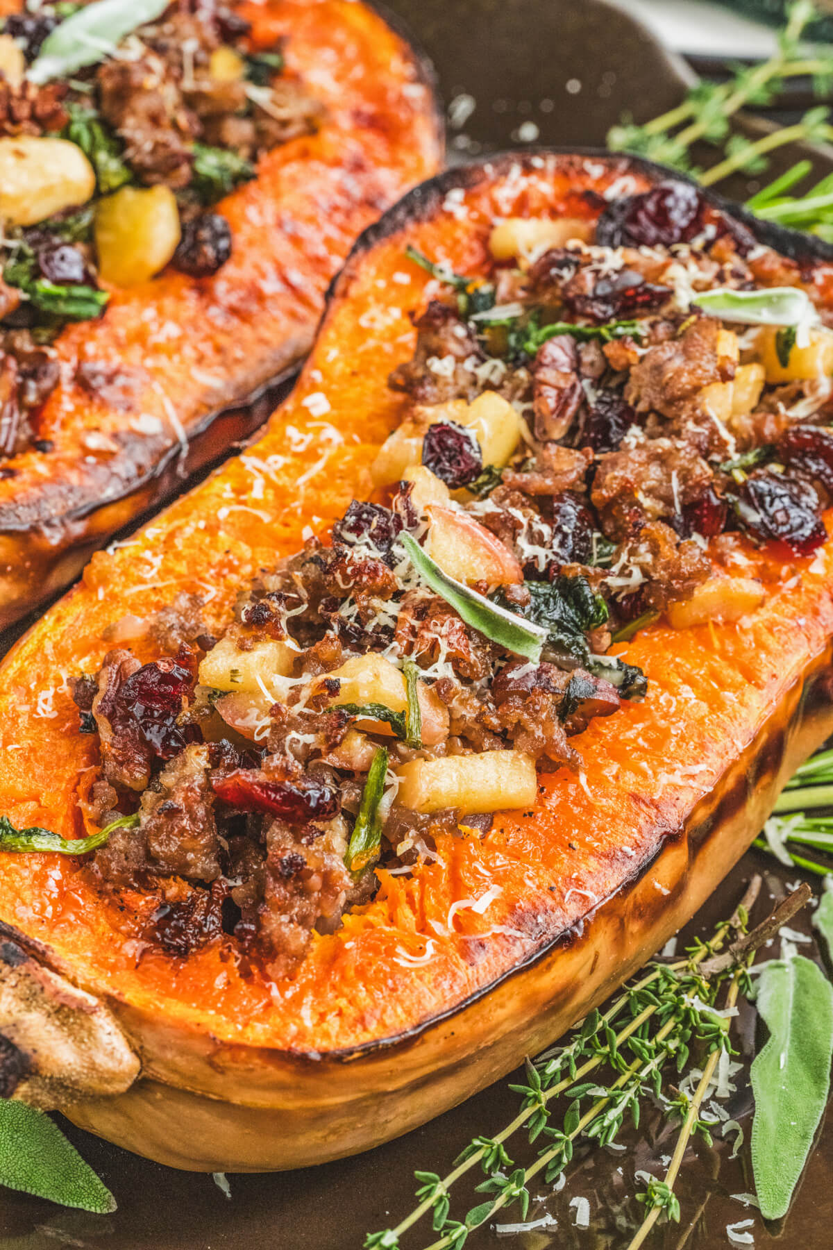 Bright orange roasted squash filled with Italian sausage, pecans, herbs, and dried cranberries then topped with Parmesan cheese.