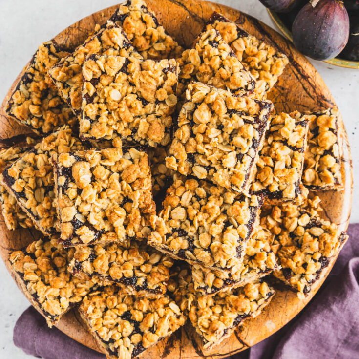 An overhead photo of a platter of golden baked crumbly Fig Bars.
