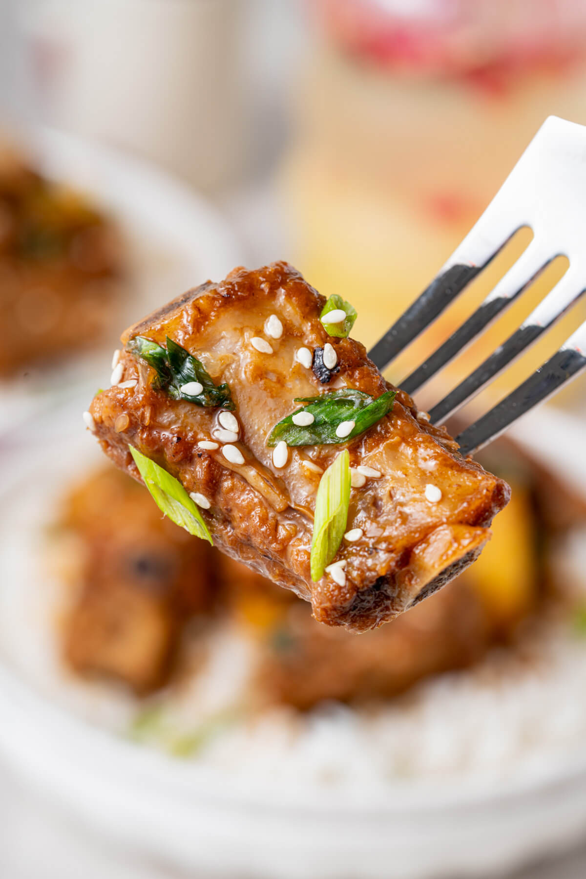 These tender, fall-off-the-bone Sticky Pork Ribs with Pineapple are coated in a sweet-savoury glaze that’s full of rich, umami flavour. A touch of pineapple adds brightness and natural sweetness, balancing the richness of the braised ribs. This easy, flavour-packed dish is perfect served over rice for a comforting and delicious meal the whole family will love.