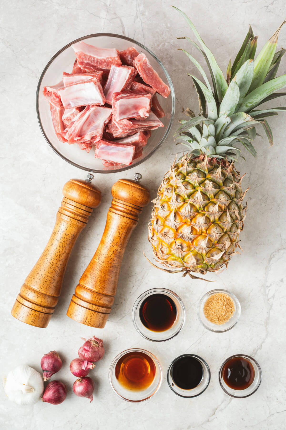 These tender, fall-off-the-bone Sticky Pork Ribs with Pineapple are coated in a sweet-savoury glaze that’s full of rich, umami flavour. A touch of pineapple adds brightness and natural sweetness, balancing the richness of the braised ribs. This easy, flavour-packed dish is perfect served over rice for a comforting and delicious meal the whole family will love.