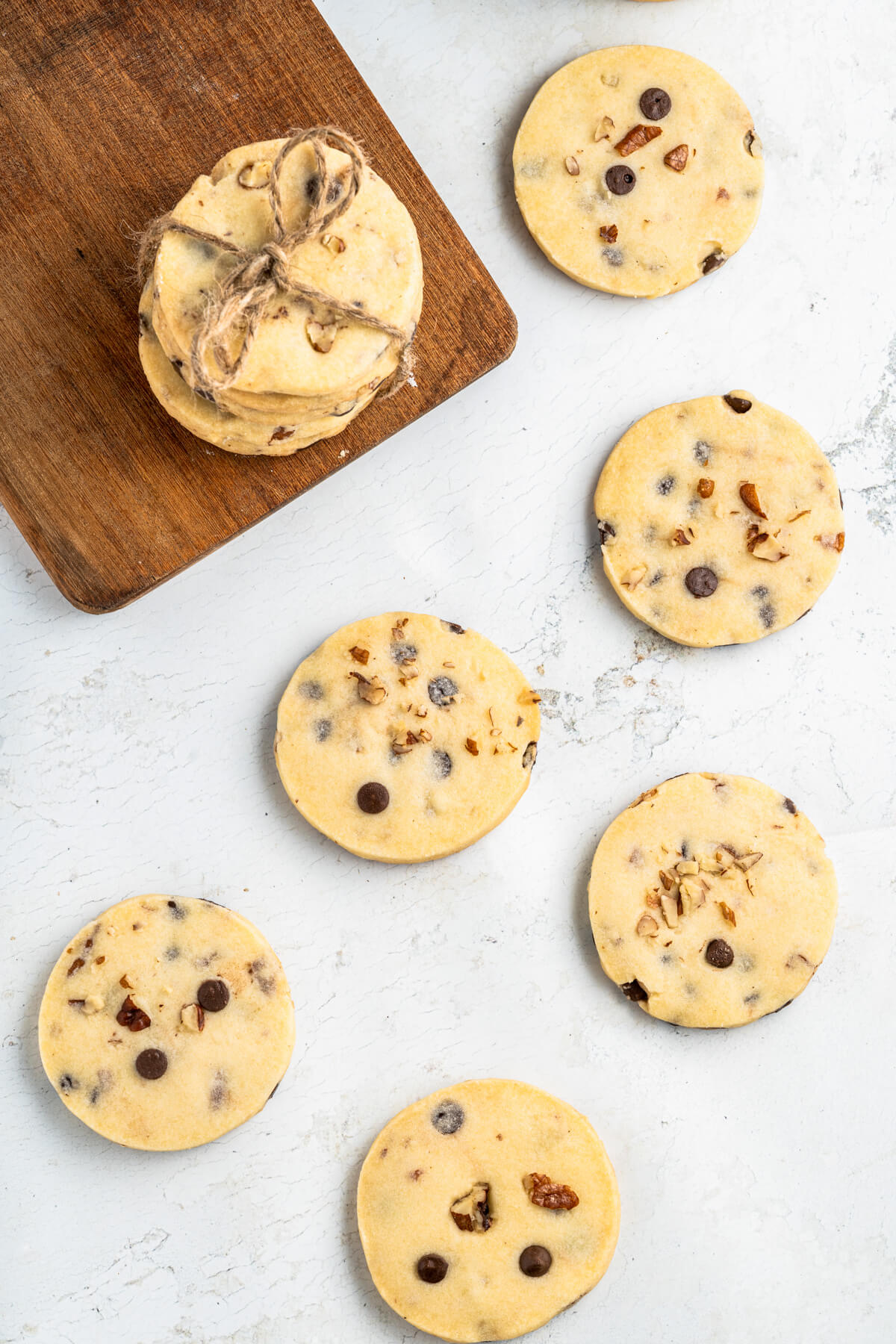 A group of Chocoalte Chip Shortbread Cookies on a white marble table.