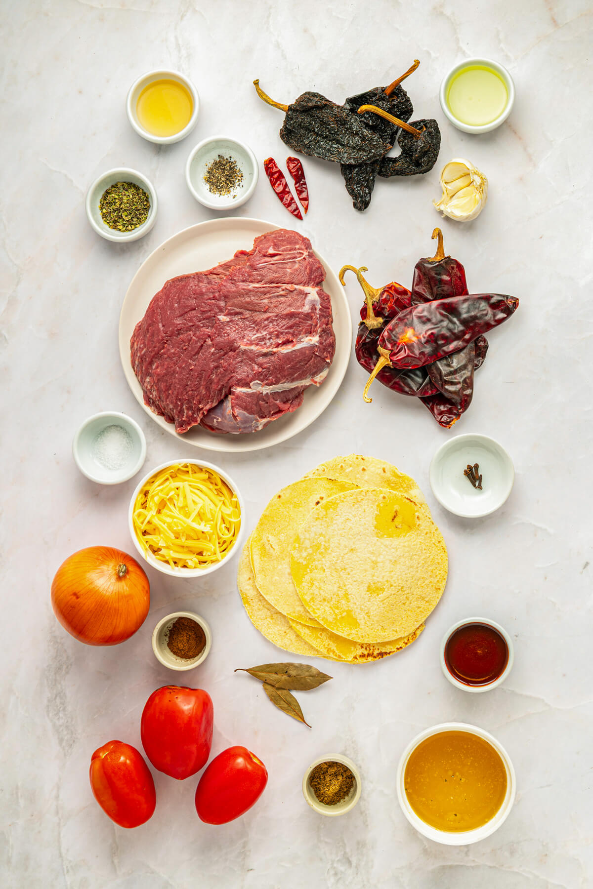 Ingredients required to make beefy birria tacos.