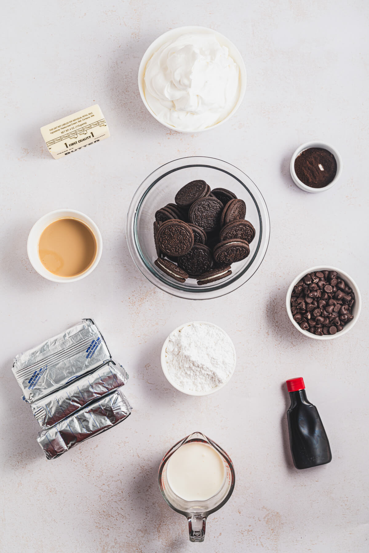 Ingredients required to make Bailey's Cheesecake topped with chocolate ganache.